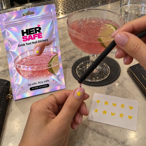 One drop of drink on a HerSafe star sticker at the bar